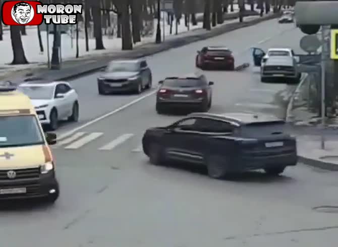 Video :Video - A man on a bike is pulled by an SUV after being flung through a door (Warning - frightening)
